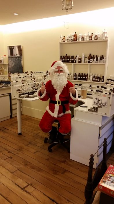 Perfumer Fredrik Dalman dressed as Santa, at his perfume organ