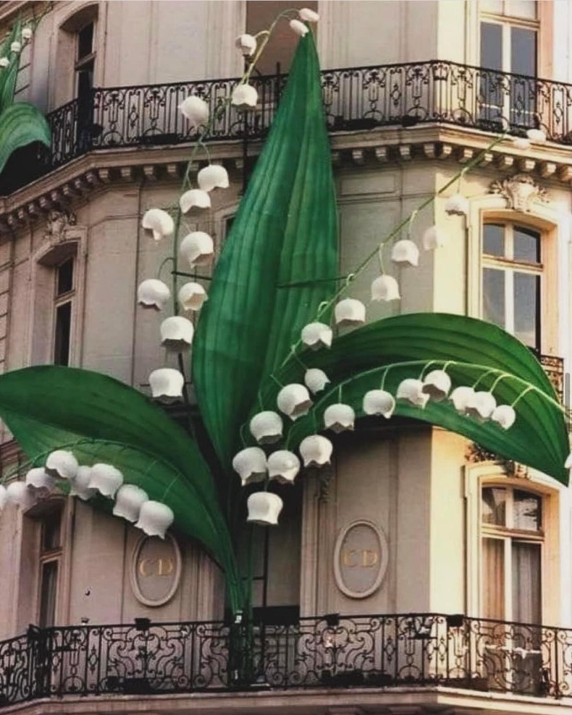 Huge sculptures of lily of the valley decorating Dior's flagship boutique in Paris.